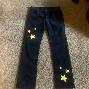 Dark blue slim jeans with yellow stars